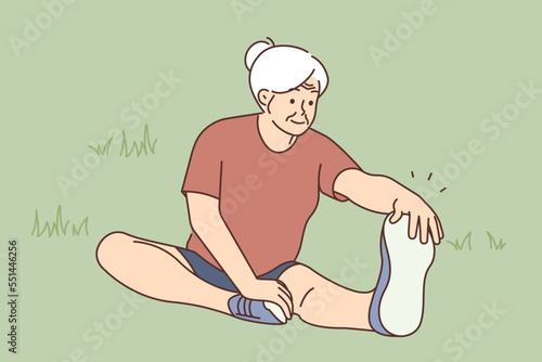 Active elderly woman training in park 