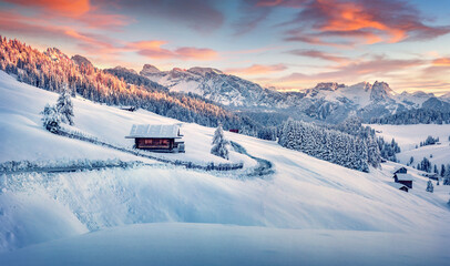 Astonishing morning view of Alpe di Siusi village. Unbelievable winter scene of Dolomite Alps. Amazing landscape of ski resort, Ityaly, Europe. Beauty of nature concept background.