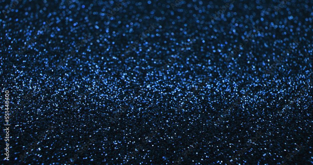 Fototapeta premium Bokeh light background. Blur glitter texture. Fantasy glare. Defocused blue color shiny sparkles glow reflection on dark black abstract free space poster.