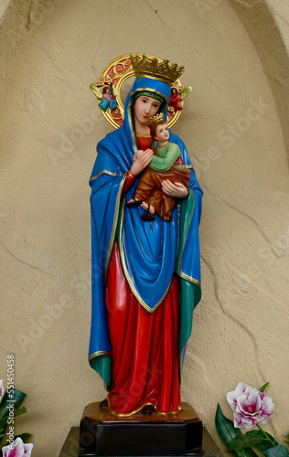 Closeup of Our lady of perpetual help statue virgin Mary with Child Jesus in the church, Thailand. selective focus.