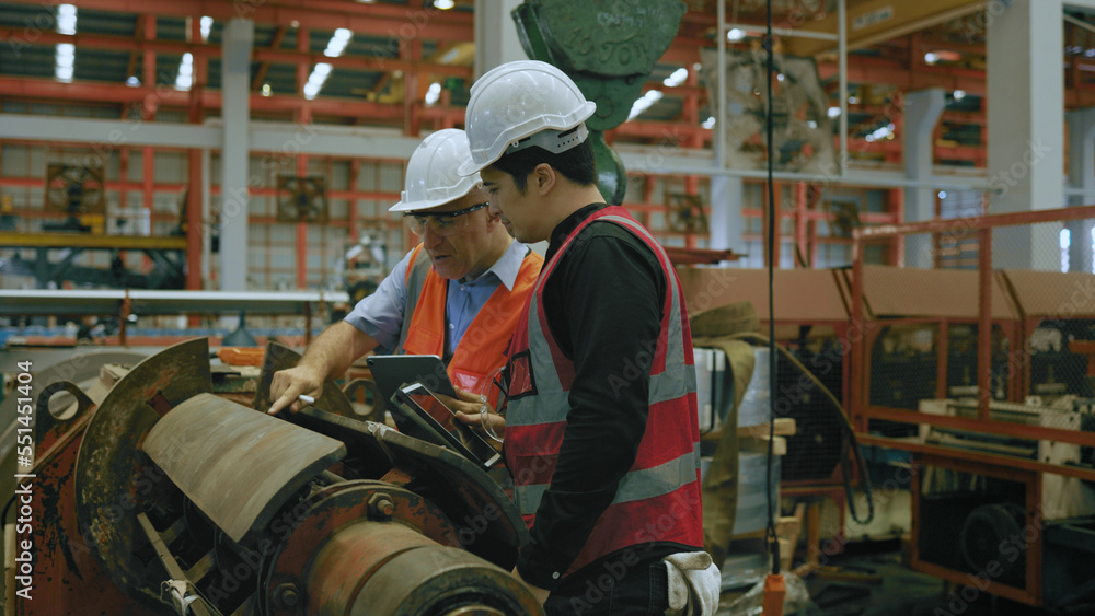 Two caucasian engineers are meeting to find a solution to the problem, improve of the machines Two caucasian engineers are meeting to find a solution to the problem, improve of the machines