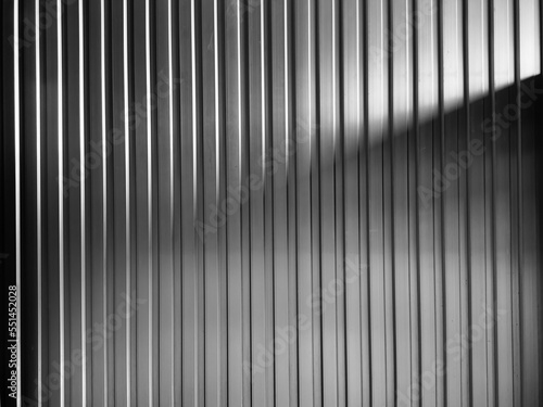 Black aluminum wall in shadow