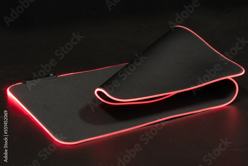 large flexible backlit mouse pad on a dark background