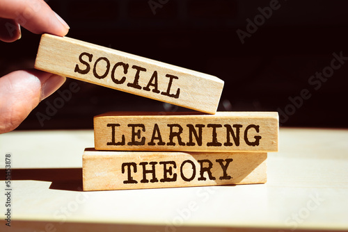 Wooden blocks with words 'Social learning theory'.