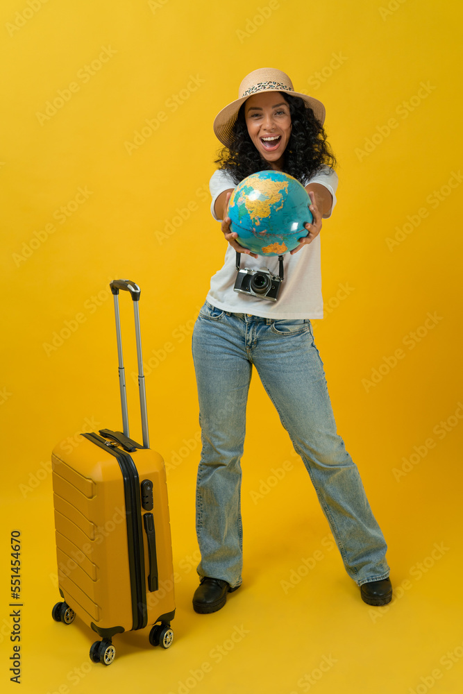 Happy Traveller curly latin woman wears white t-shirt with suitcase bag ...