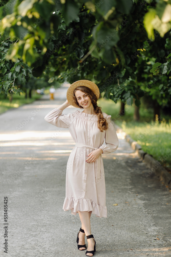 Obraz premium Young couple in love outdoor.Stunning sensual outdoor portrait of young stylish fashion couple posing in summer in field
