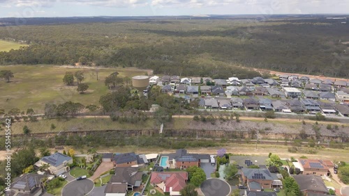 Aerial drone view of Voyager Point in South West Sydney, NSW Australia heading toward the train line and Heathcote Road   photo