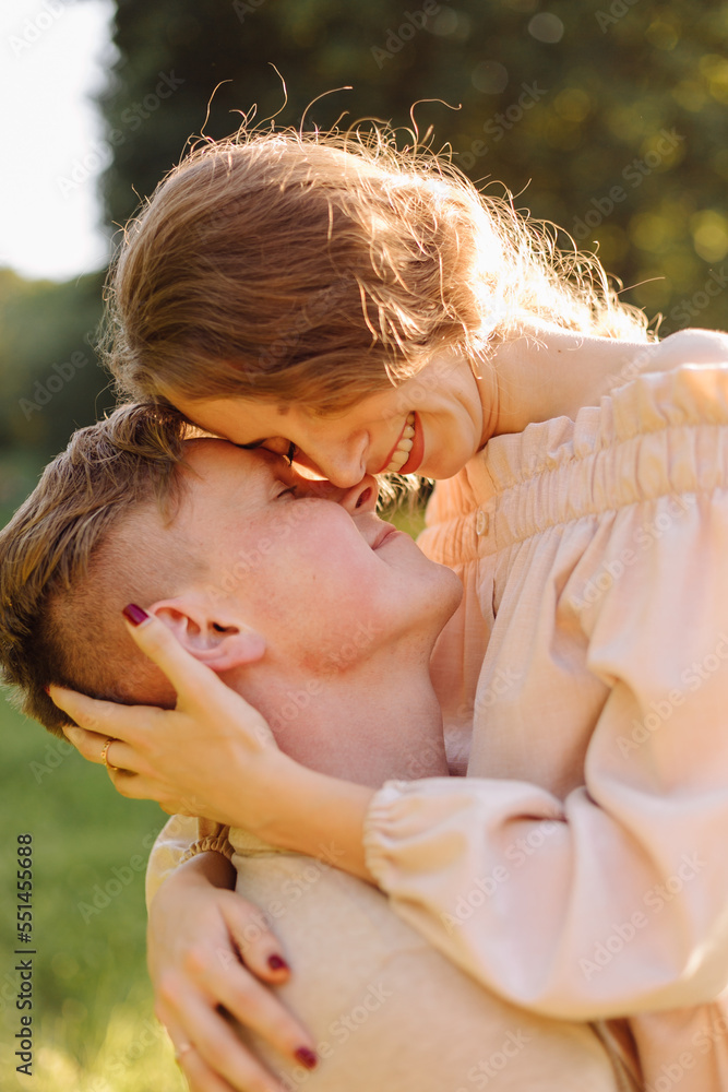 Young couple in love outdoor.Stunning sensual outdoor portrait of young stylish fashion couple posing in summer in field