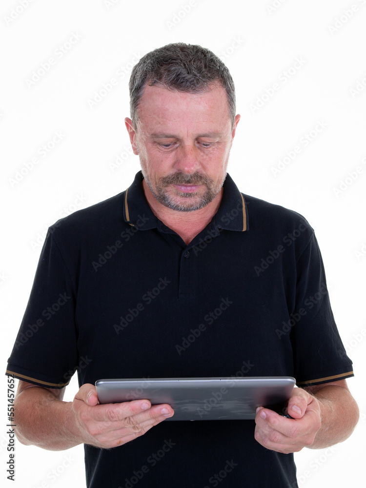 mature man holding in hands tablet ebook analyzing review report on white background mature man holding in hands tablet ebook analyzing review report on white background