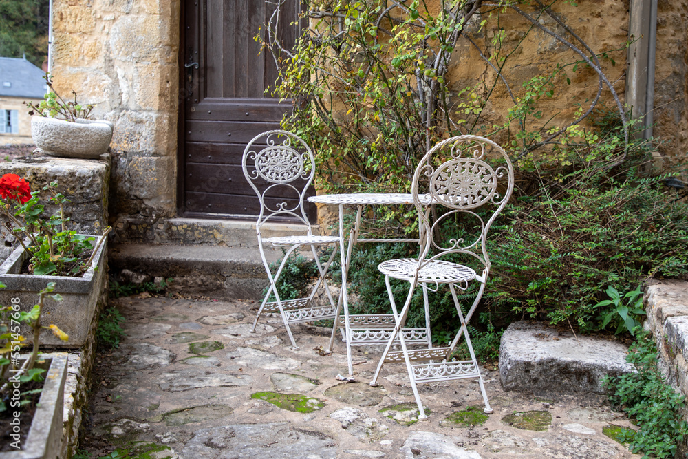 metal white chair seat table gray in summer in street city ancient medieval village
