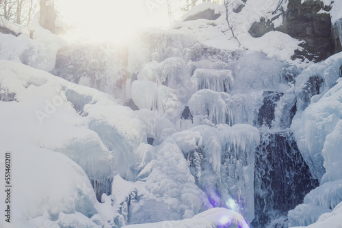 Frozen waterfall landscape photo. Beautiful nature scenery photography with snowy wilderness on background. Idyllic scene. High quality picture for wallpaper, travel blog, magazine, article © Gypsy On The Road