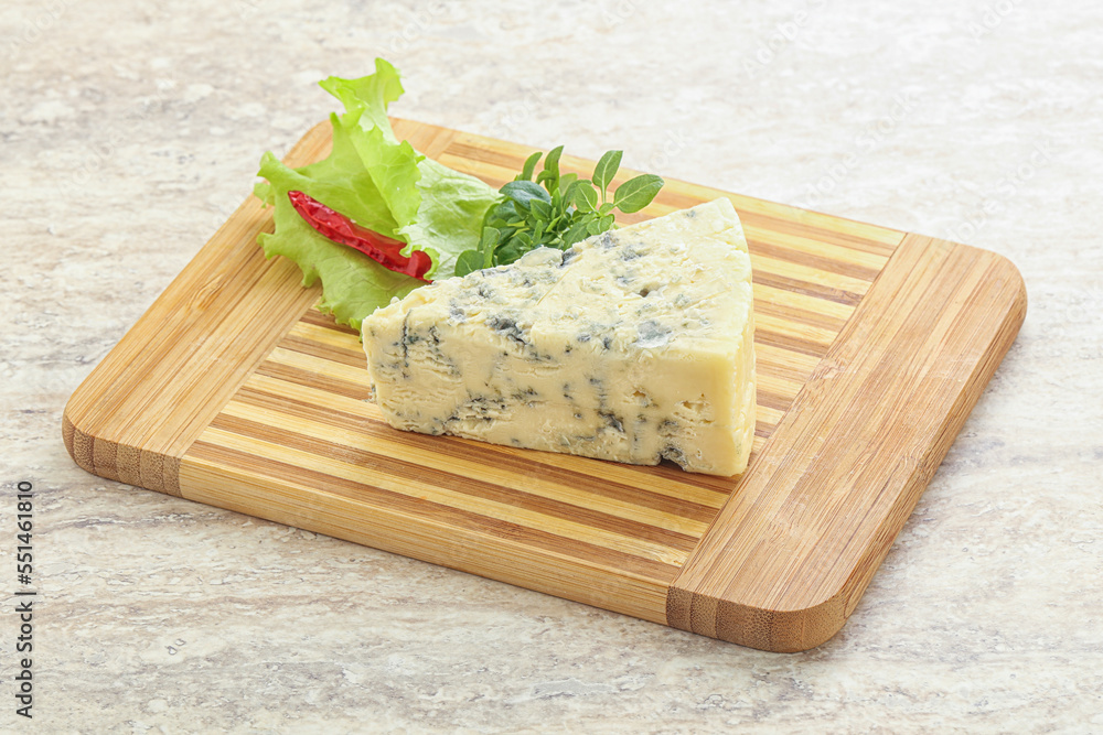 Blue cheese piece over board
