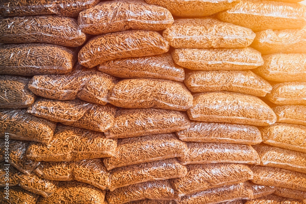 Close-up of stacked wood pellets. Detailed shot of woodpellets. Pellet texture Close-up of stacked wood pellets. Detailed shot of woodpellets. Pellet texture
