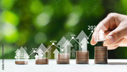 Beginning new year 2023, growing finance with trading charts in finance and stock investment business concept, new life, new business, plan, goal, strategy concept.