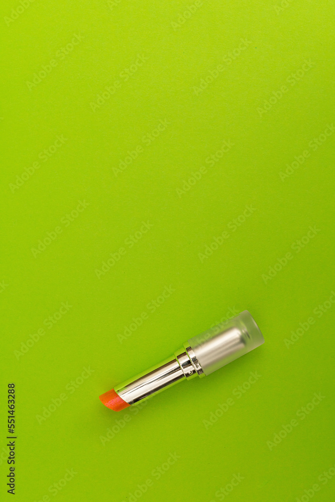Green lipstick on green background, monochrome Green lipstick on green background, monochrome