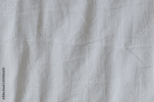 Wrinkled white bed sheets in the bedroom as background