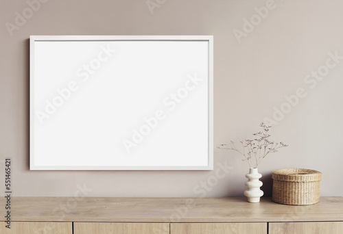 Empty horizontal frame mockup in modern minimalist interior with plant in trendy vase on white wall background. Template for artwork, painting, photo or poster