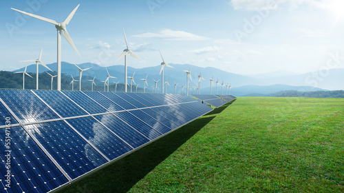 Solar panels and wind generators under blue sky photo