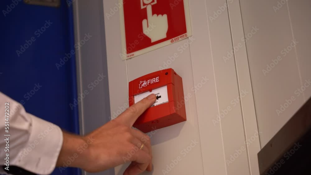 Ships crew showing how to release fire alarm onboard ship Low angle