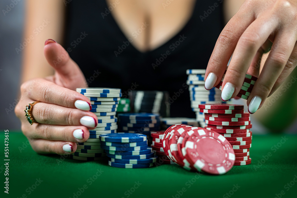 woman in dress wins a game of blackjack and is happy with all the chips after playing poker. woman in dress wins a game of blackjack and is happy with all the chips after playing poker.
