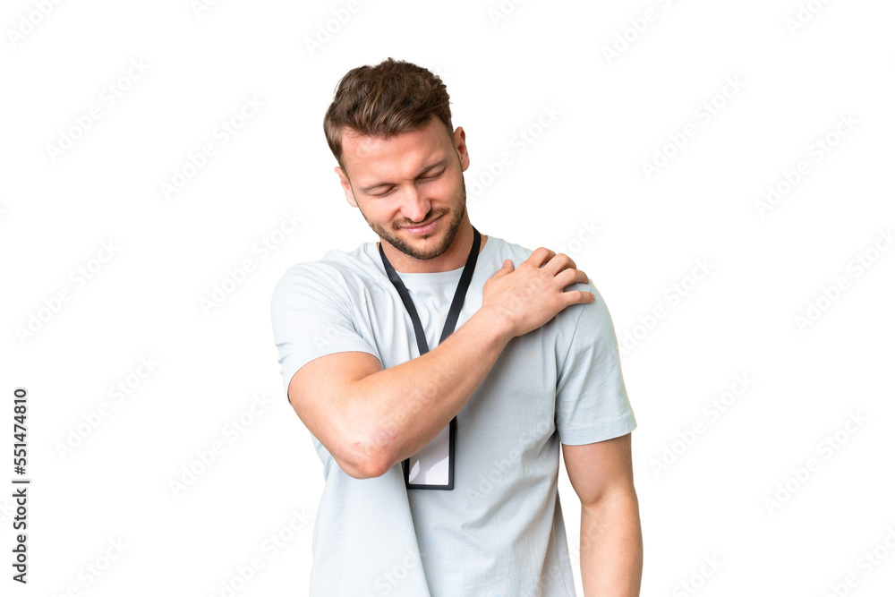 Young caucasian man with ID card over isolated chroma key background suffering from pain in shoulder for having made an effort Young caucasian man with ID card over isolated chroma key background suffering from pain in shoulder for having made an effort
