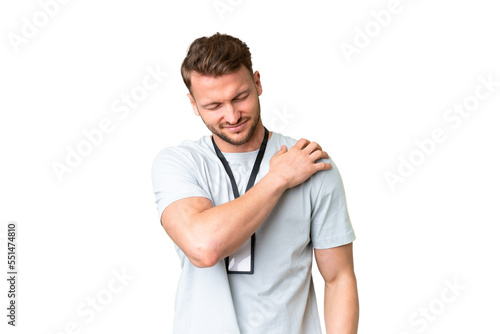 Young caucasian man with ID card over isolated chroma key background suffering from pain in shoulder for having made an effort