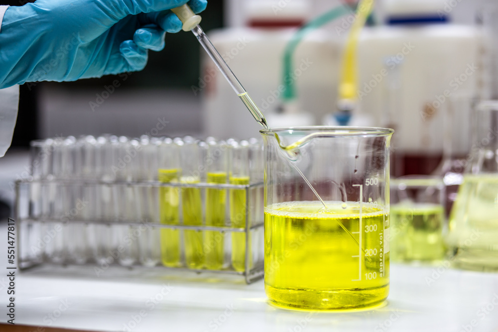 Scientist uses a dropper to aspirate sample solution mixed with an emulsifier and active compound in a beaker for formulation test of the cosmetic product. Research and Development cosmetics.
Scientist uses a dropper to aspirate sample solution mixed with an emulsifier and active compound in a beaker for formulation test of the cosmetic product. Research and Development cosmetics.