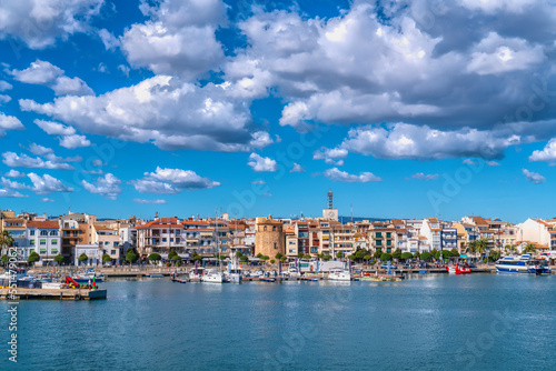 Cambrils seafront Spain boats and buildings in Tarragona Province Catalonia with blue Mediterranean sea and sky

