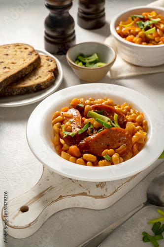 Beans with sausage and tomato sauce. Beans stew, homemade rustic english food. Bright background