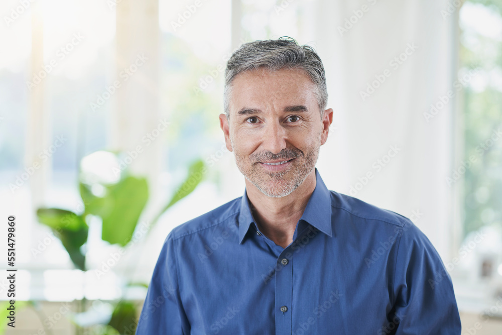 Smiling mature man with gray hair at home Smiling mature man with gray hair at home