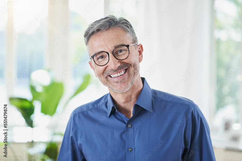 Happy man wearing eyeglasses at home Happy man wearing eyeglasses at home
