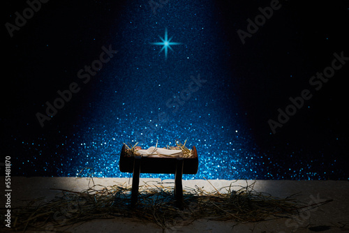 Fototapete Nativity of Jesus, empty manger at night with bright lights.