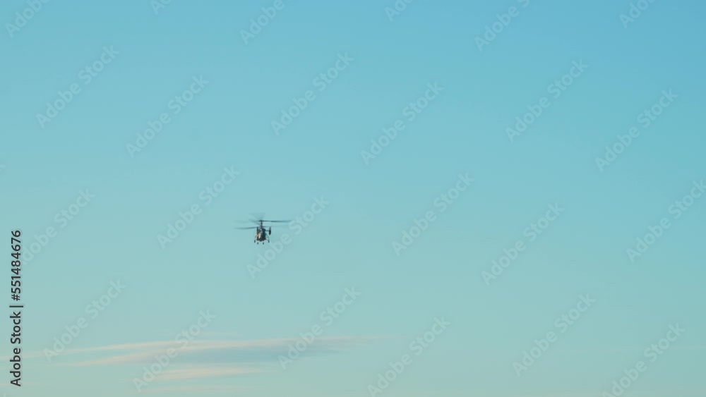 Rescue helicopter flies away. Coaxial rescue marine helicopter flies, general plan Rescue helicopter flies away. Coaxial rescue marine helicopter flies, general plan
