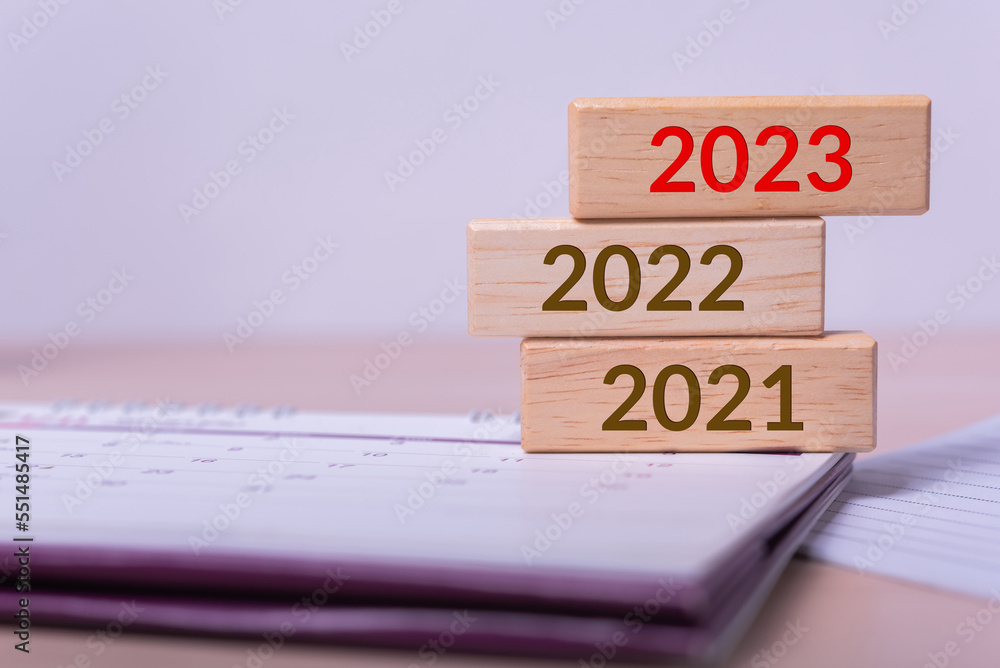 abstract wood cube building block with text 2023 on it abstract wood cube building block with text 2023 on it