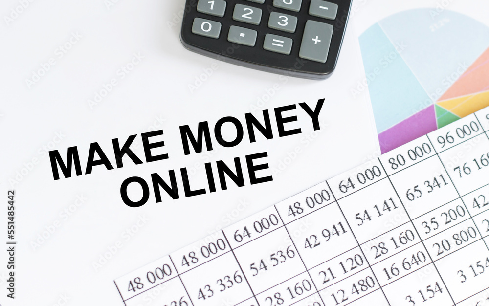 Notebook writing Make Money Online, Office table with laptop ,coffee cup,glasses Notebook writing Make Money Online, Office table with laptop ,coffee cup,glasses