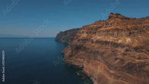 aerial shot of the mountains that surround the Tasarte beach in the Aldea de San Nicolas on the island of Gran Canaria and on a sunny day. photo