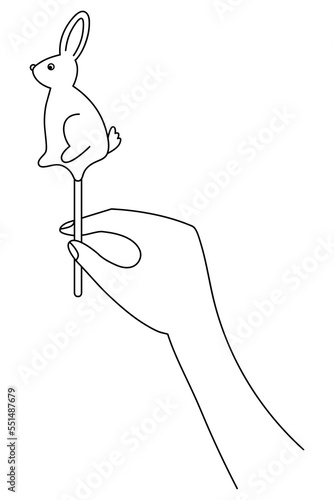 Hold a lollipop in your hand. Sketch. Candy in the form of a rabbit in the palm of your hand. Vector illustration. Sugar caramel bunny on a stick. Coloring book for children. An animal with long ears.