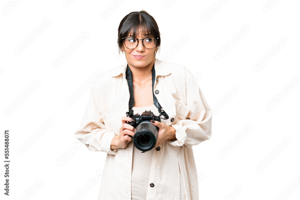 Young photographer caucasian woman over isolated chroma key background making doubts gesture while lifting the shoulders Young photographer caucasian woman over isolated chroma key background making doubts gesture while lifting the shoulders