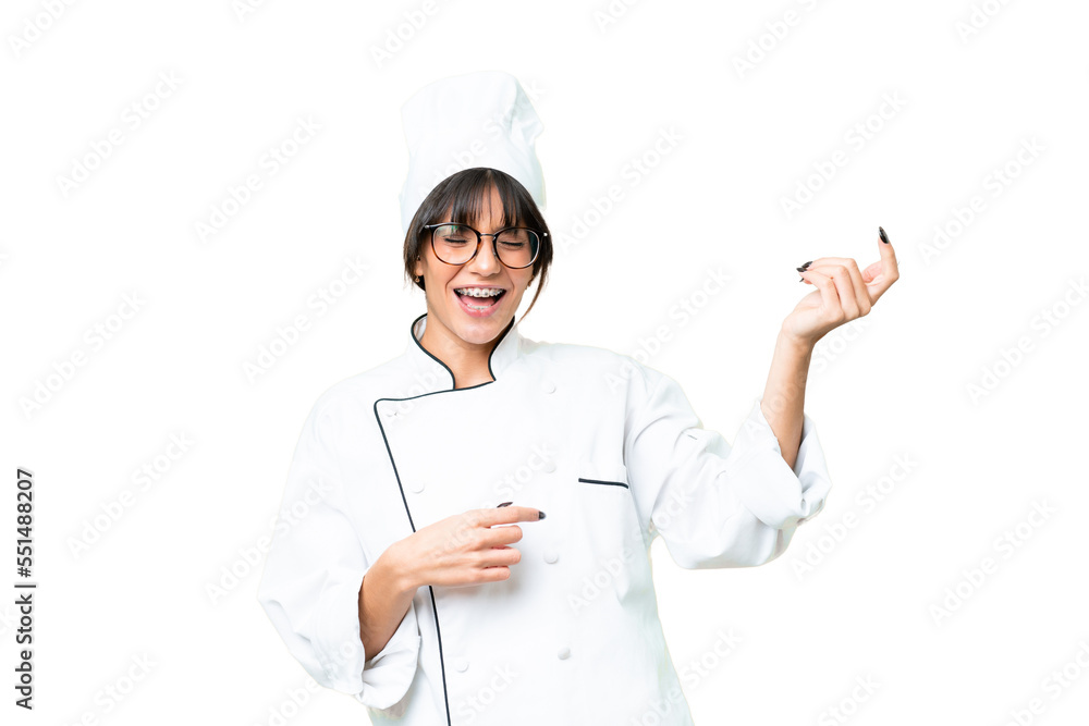 Young caucasian chef woman over isolated chroma key background making guitar gesture Young caucasian chef woman over isolated chroma key background making guitar gesture