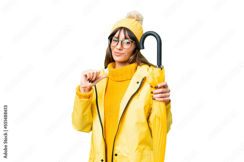 Young caucasian woman with rainproof coat and umbrella over isolated chroma key background proud and self-satisfied Young caucasian woman with rainproof coat and umbrella over isolated chroma key background proud and self-satisfied