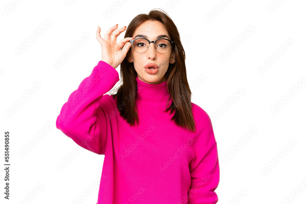 Young caucasian woman over isolated chroma key background with glasses and surprised Young caucasian woman over isolated chroma key background with glasses and surprised