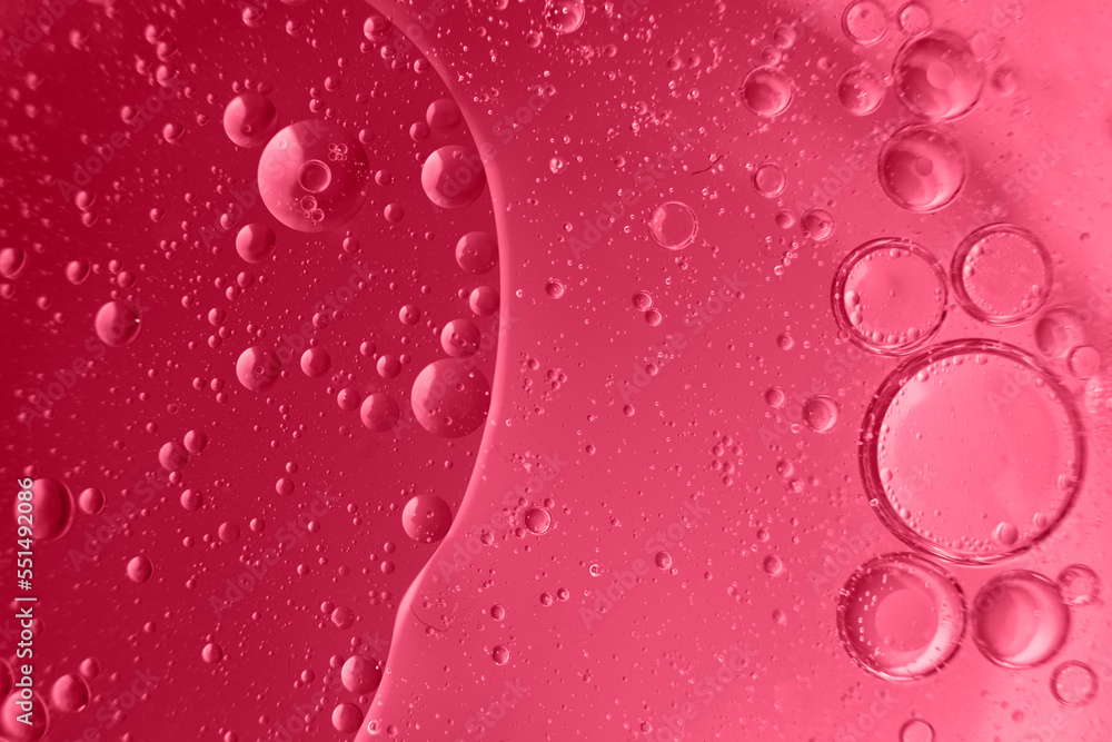 abstract light viva magenta background with oil circles . bubbles of water close up abstract light viva magenta background with oil circles . bubbles of water close up