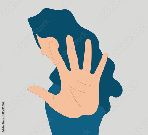 Young woman says NO with her palm or forehand. Strong female protests and expresses disagreement. STOP and ENOUGH of domestic violence, gender inequality, abuse and bullying. Women's rights concept.