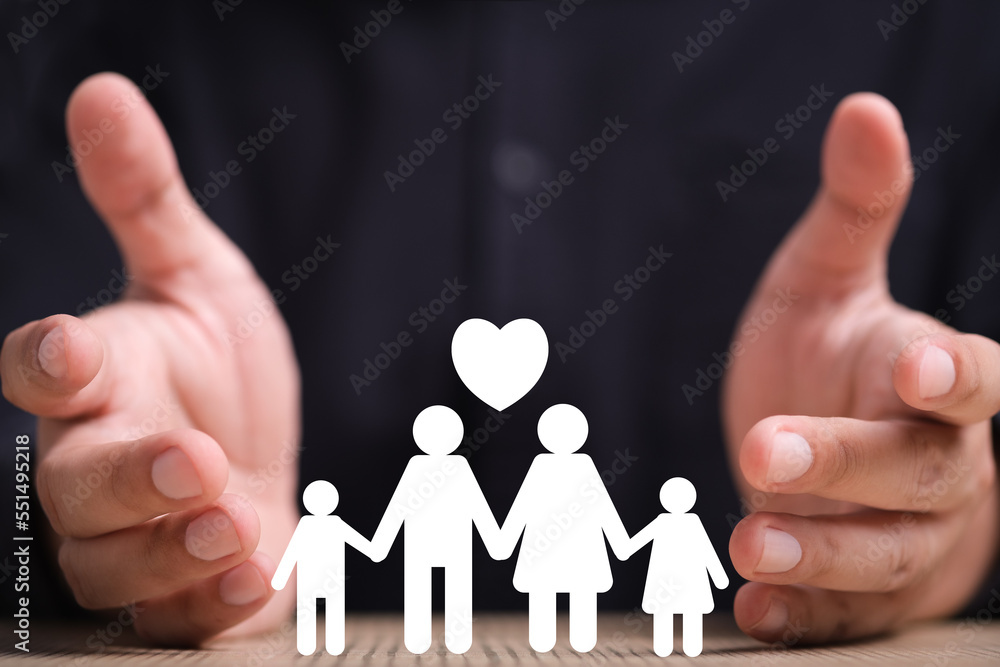 leader man hand holding paper family decor on wooden table background. Love family and take care family life plan. leader man hand holding paper family decor on wooden table background. Love family and take care family life plan.