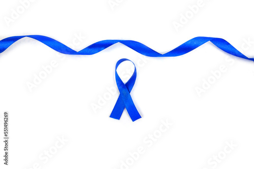 Top view photo of blue satin ribbon symbol of prostate cancer awareness on isolated old background photo