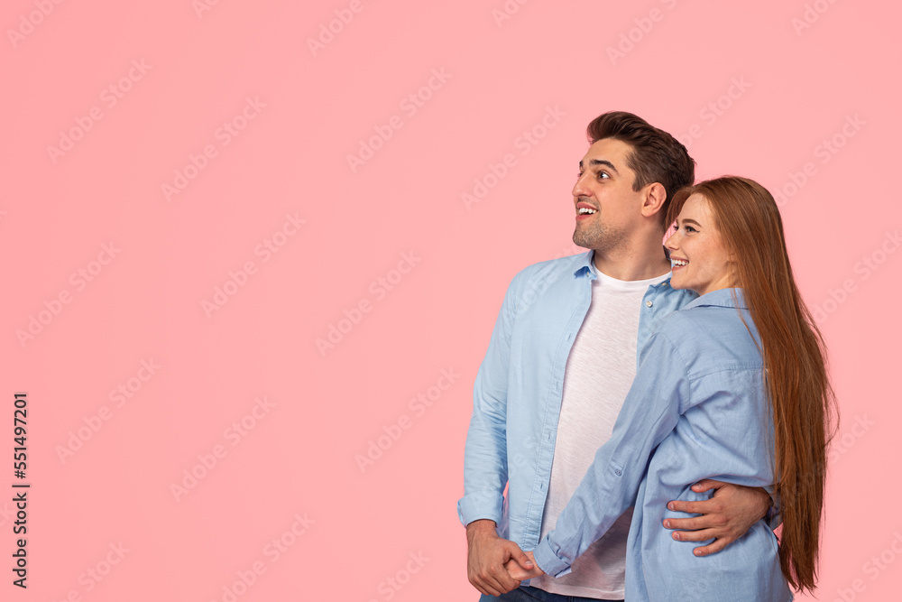 Amazed couple looking away together Amazed couple looking away together