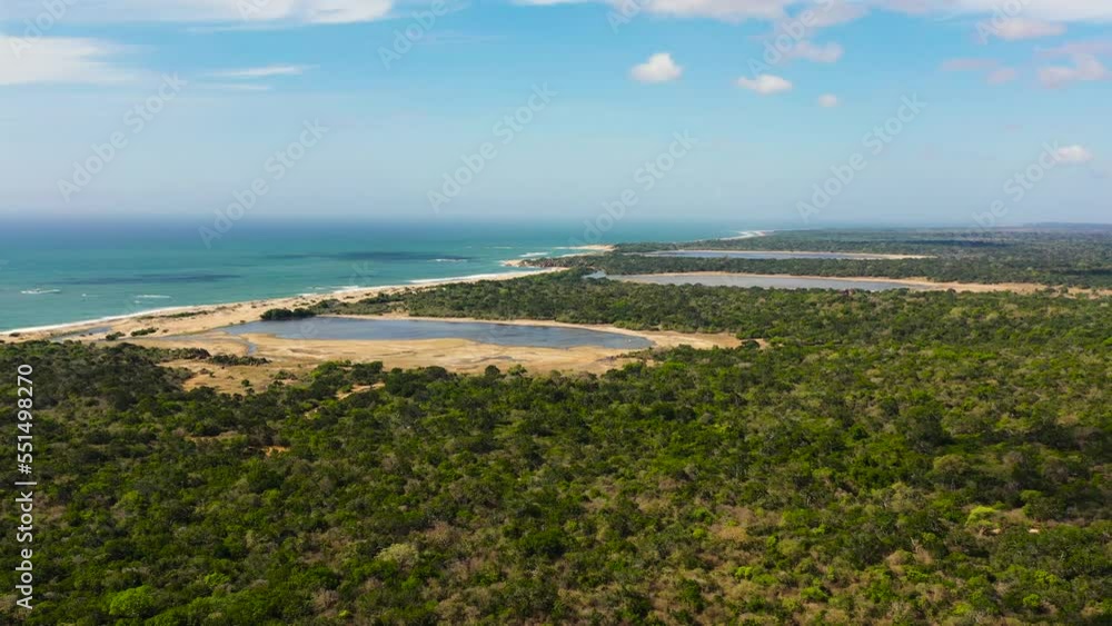 Aerial view of Lakes among the rainforest in the Kumana National Park. Sri Lanka. Tropical landscape. Aerial view of Lakes among the rainforest in the Kumana National Park. Sri Lanka. Tropical landscape.