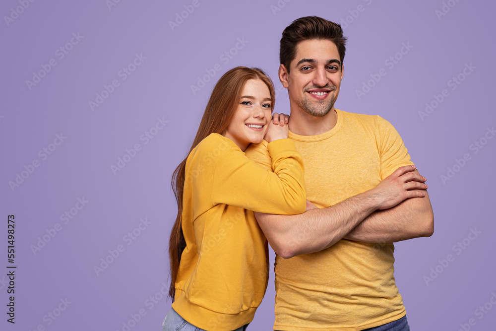 Positive boyfriend and girlfriend in similar clothes Positive boyfriend and girlfriend in similar clothes