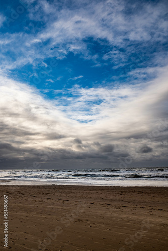 Clouds parting for blue sky