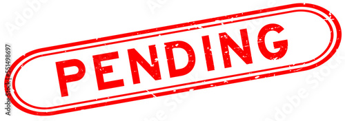 Grunge red pending word rubber seal stamp on white background